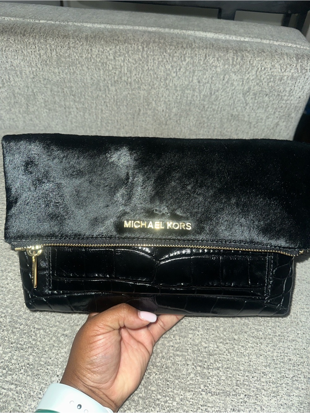 Michael Kors Black Fold-Over Clutch with gold hardware